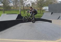 A boy on his BMX bike doing a bunny hop at Gadebridge Park skate park