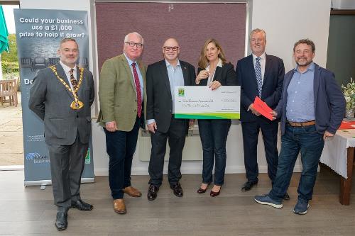 Anna Hutton-North receives a cheque from the Dacorum's Den panel