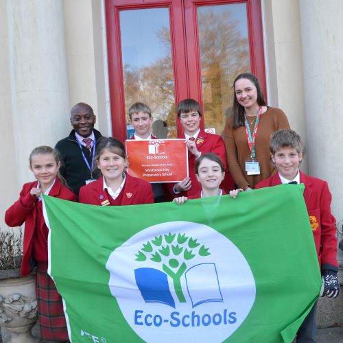 Westbrook Hay Eco Warriors hold up Green Flag